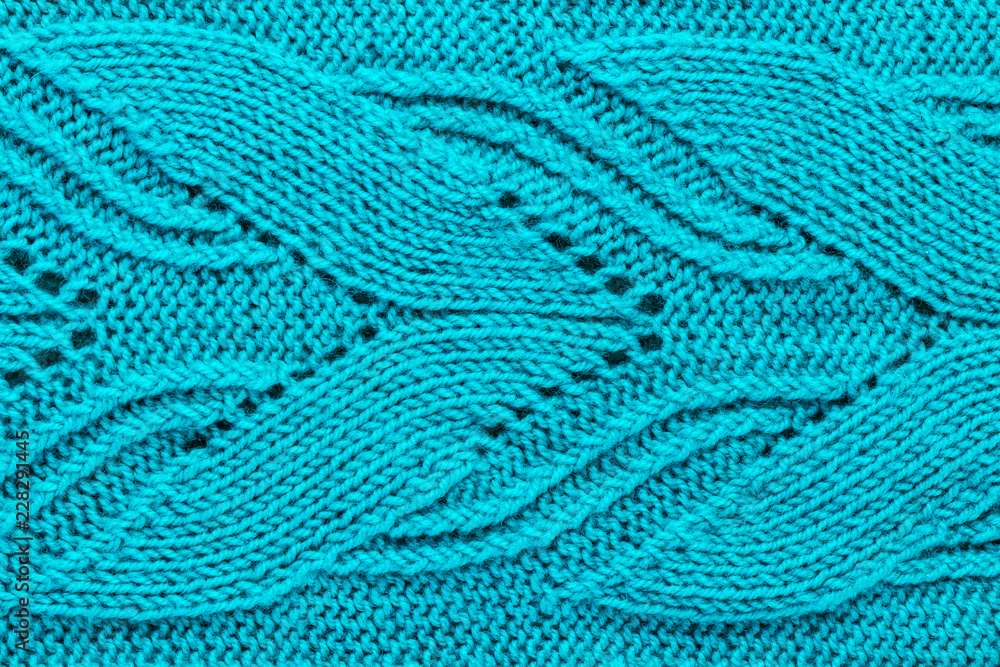The texture of a turquoise knitted yarn. Knitted and winter clothes The texture of a turquoise knitted yarn. Knitted and winter clothes