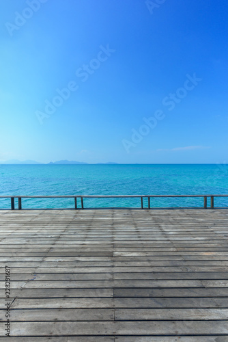 Wood floor on blue sea background