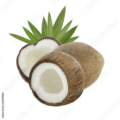heap of coconuts with leaves isolated on white background