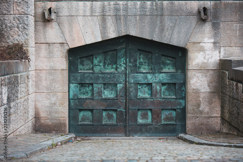 Εκτύπωση καμβά A huge green metal door  with squares on a building in Brussels Belgium