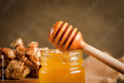 honey dipper and honeycomb. nuts and apples with honey and nuts of various kinds