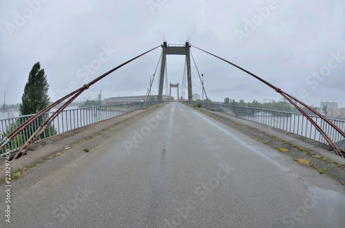 View of old abandoned cable-stayed Rybalskii bridge, Kyiv,Podol, Ukraine