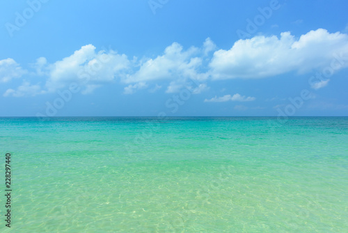 Tropical sea and wave against blue sky © yotrakbutda