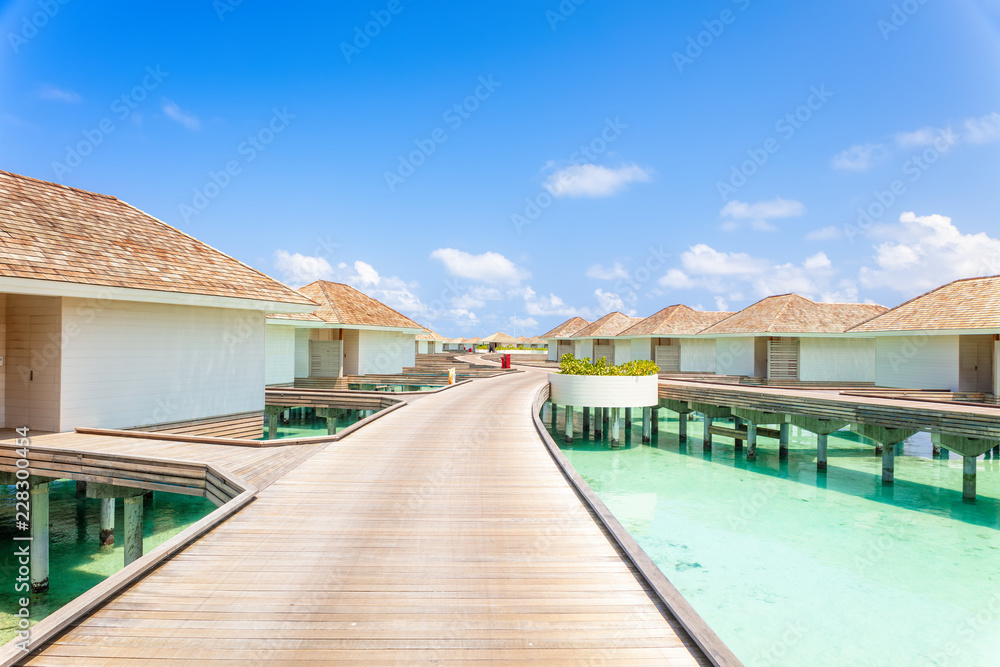 Tropical Water villas on Maldives island, holiday vacation background concept