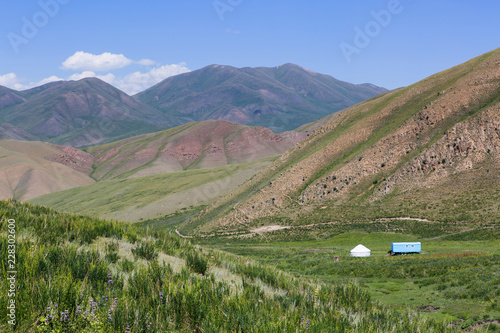 Caravan, Yurt and Landscape of the Kochkor Valley, in the Tian Shan Mountains, Kyrgyzstan photo