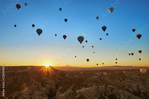 Hot air balloons in the sky during sunrise in Cappadocia, Turkey