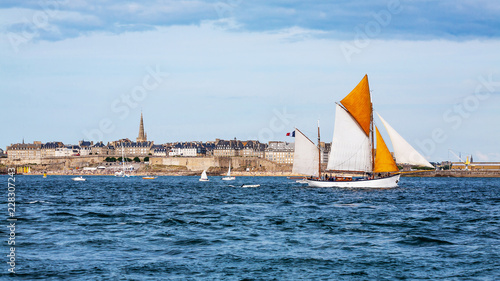 Seaside view of Saint Malo and sailboat