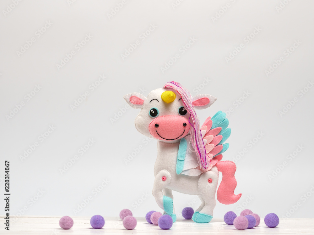children's toy horse made of felt on a white background children's toy horse made of felt on a white background