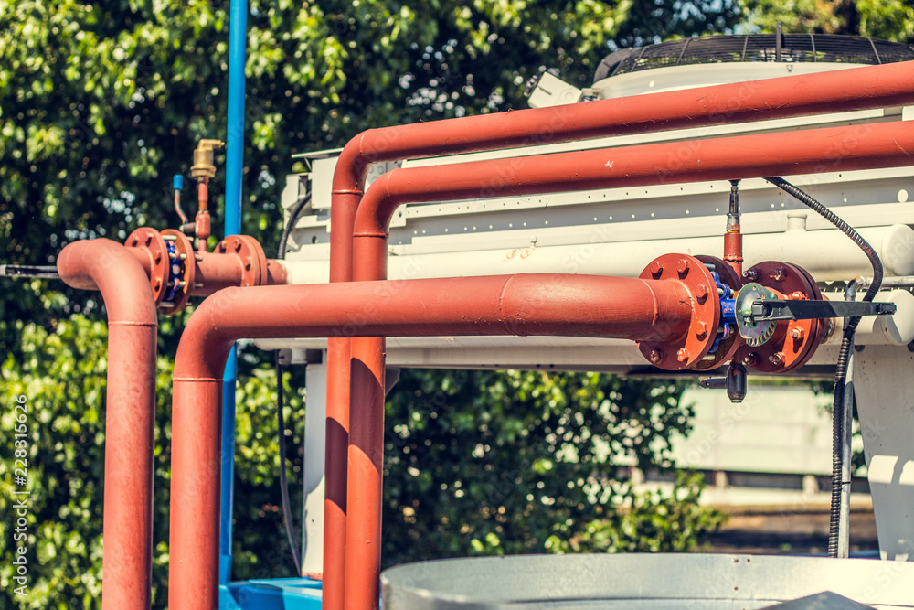 .Cooling towers at a private enterprise, pipes, valves, fans.
