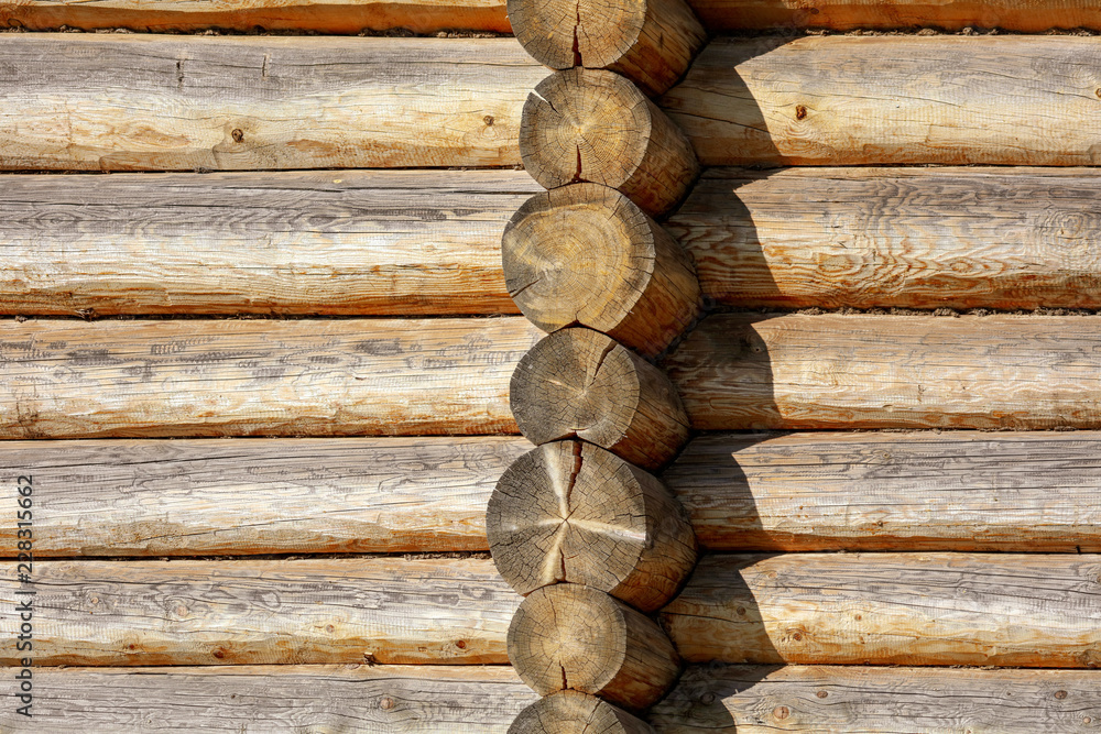 Wall with log house in the house as a background Wall with log house in the house as a background