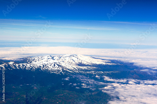 Snow covered mountails with clouds all around © KDImages