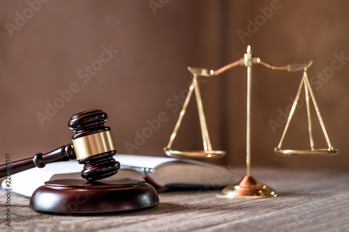 Scales of justice and Gavel on wooden table and agreement in Courtroom, Justice and Law concept