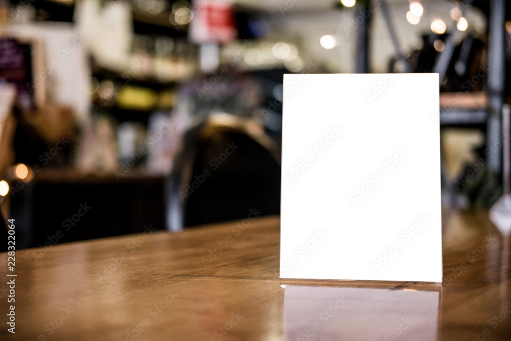 Mock up blank menu frame on table in coffee shop stand for your text of display your product Mock up blank menu frame on table in coffee shop stand for your text of display your product