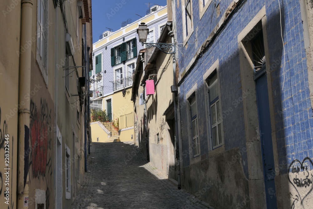 A narrow street in the old part of Lisbon, Portugal