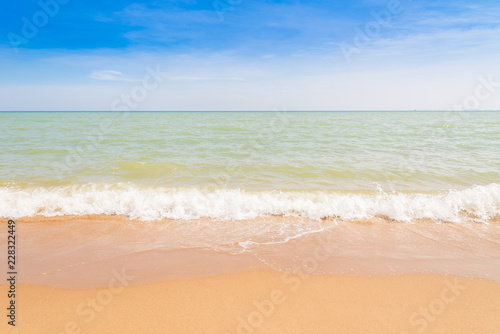 Abstract beach background. Yellow sand, blue sky and calm tropical beach landscape.Exotic nature concept.Location Satheep Thailand