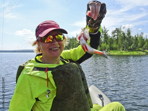 Fishing is a great catch. Caught fish in the hands of a fisherman