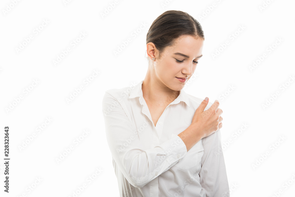 Young pretty business woman showing shoulder pain gesture Young pretty business woman showing shoulder pain gesture