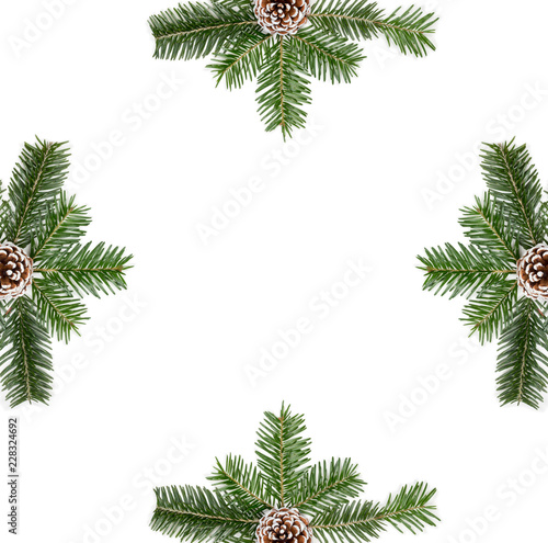 Christmas composition, frame with fir tree branches, pine cones on white background. Flat lay, top view, copy space