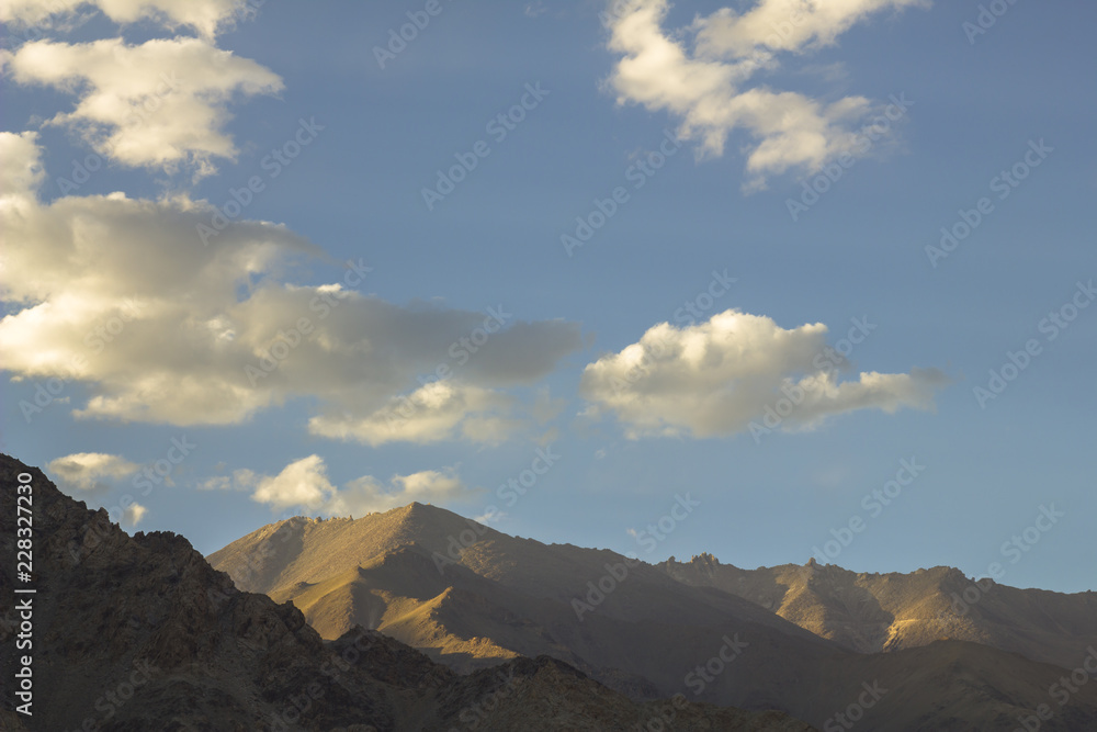 shadows on the mountains under the white clouds shadows on the mountains under the white clouds