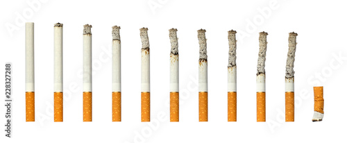 Cigarettes burning and extinguished cigarette butt on white isolated background. photo