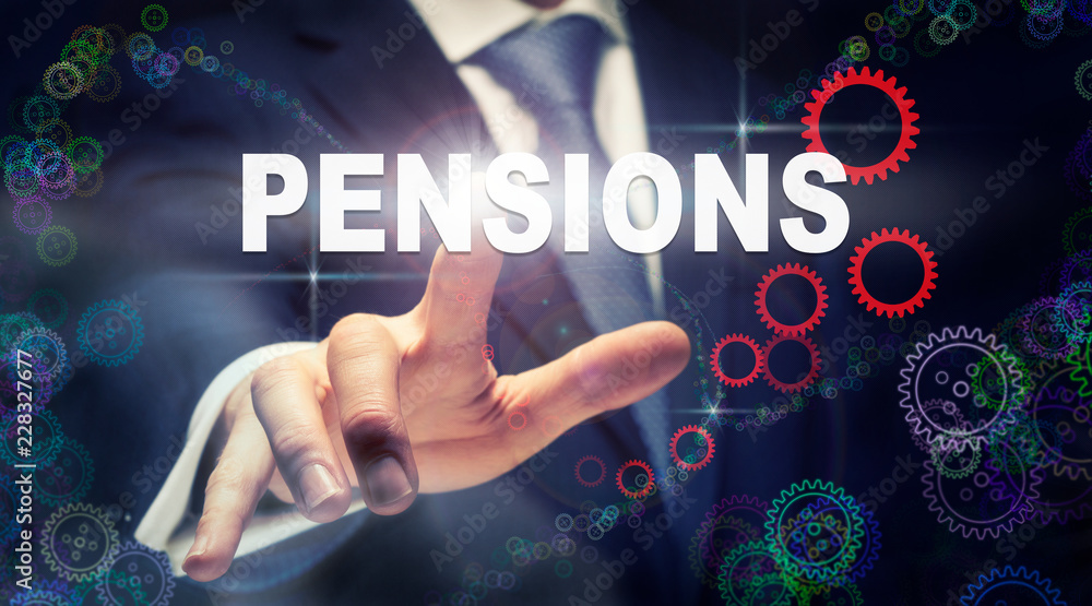 A businessman pressing a Pensions business concept on a graphical display of cogs A businessman pressing a Pensions business concept on a graphical display of cogs