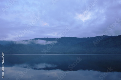 landscape of mountain with mist floating in lake