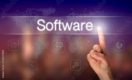 A hand selecting a Software business concept on a clear screen with a colorful blurred background.