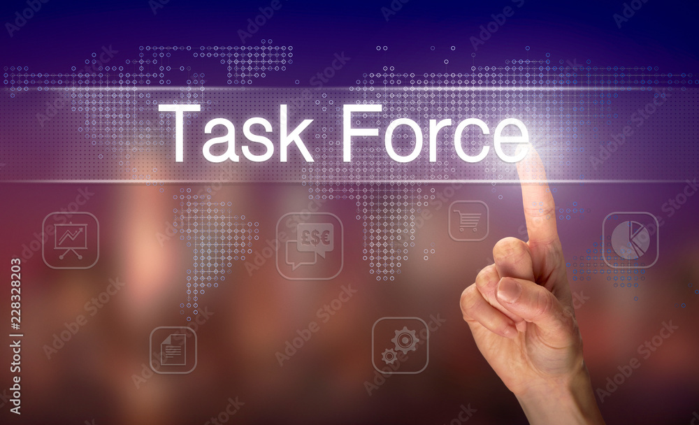A hand selecting a Task Force business concept on a clear screen with a colorful blurred background. A hand selecting a Task Force business concept on a clear screen with a colorful blurred background.