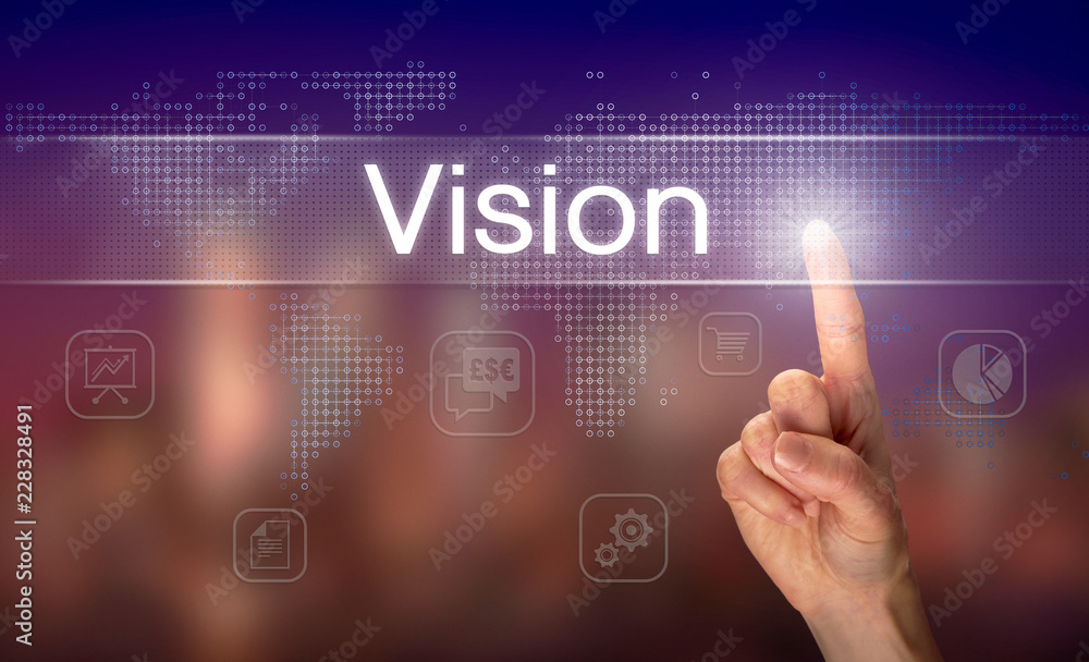 A hand selecting a Vision business concept on a clear screen with a colorful blurred background.