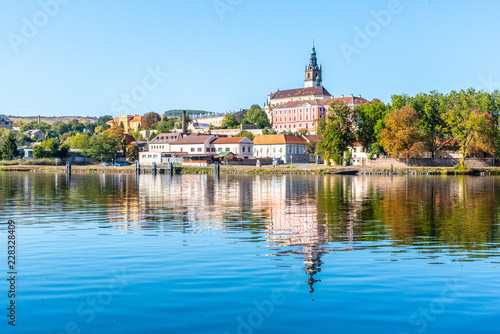 Panoramic cityscape of Litomerice reflected in Labe River, Czech Republic. © pyty