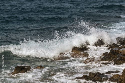 waves crashing on rocks