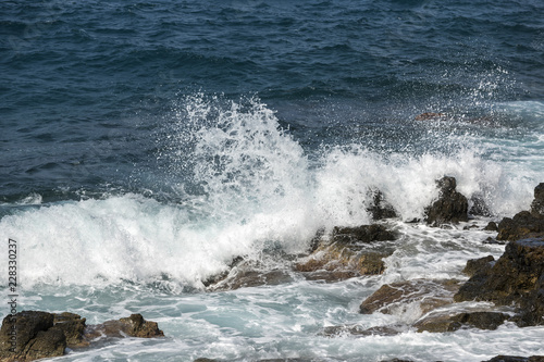 waves crashing on rocks