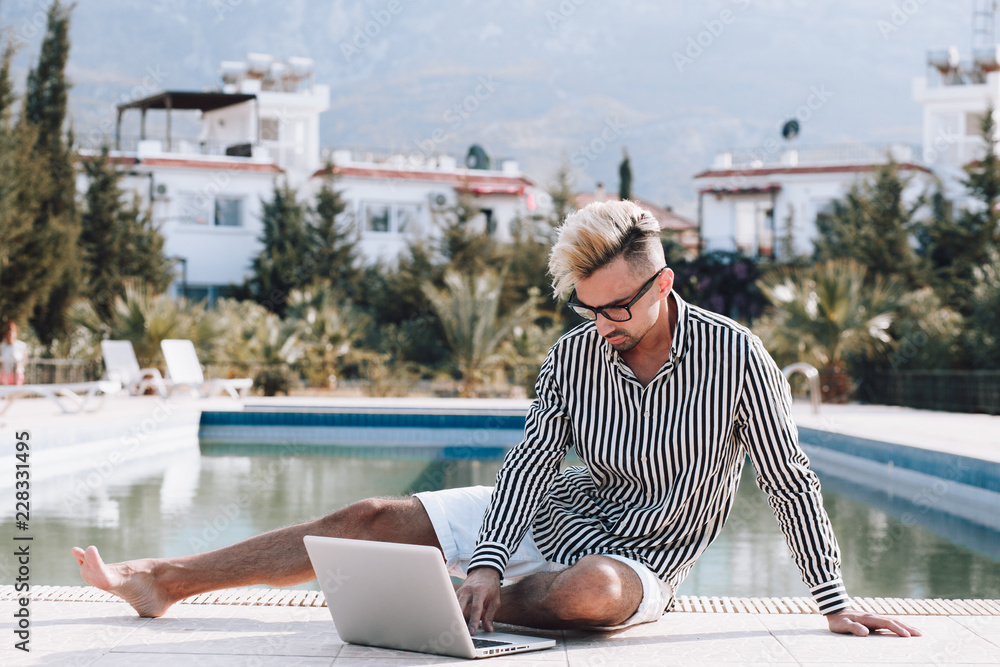 The guy with the laptop by the pool.Work on the rest.Success The guy with the laptop by the pool.Work on the rest.Success