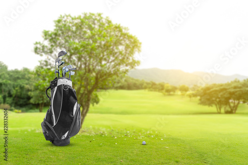 Golf equipment and golf bag , putter, ball on green and golf course as background