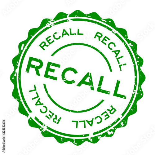 Grunge green recall word round rubber seal stamp on white background