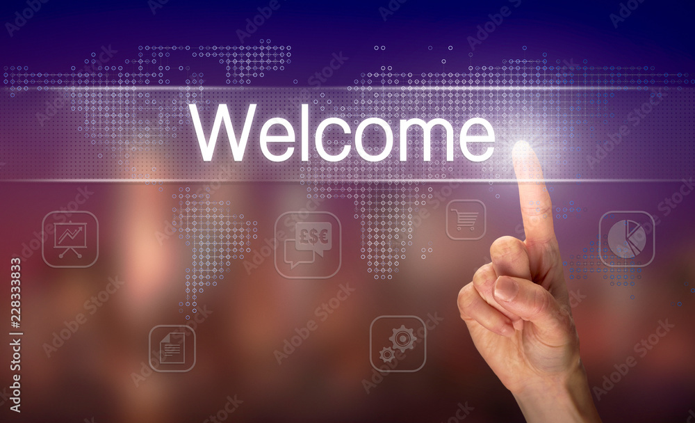 A hand selecting a Welcome business concept on a clear screen with a colorful blurred background.