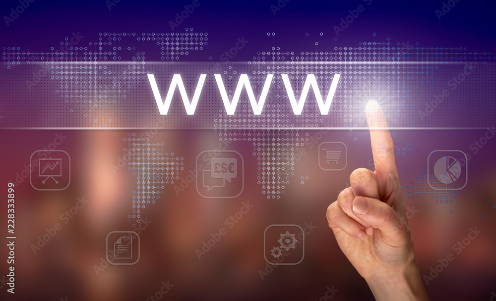 A hand selecting a www business concept on a clear screen with a colorful blurred background. A hand selecting a www business concept on a clear screen with a colorful blurred background.
