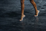 slender woman legs in high heels. women to compete in fitness bikini