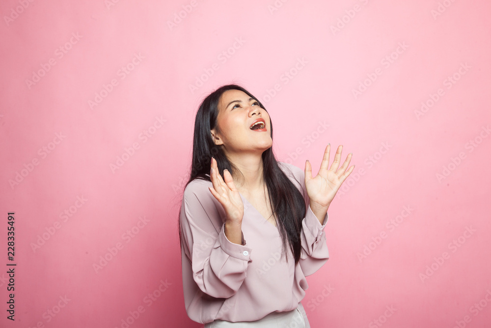 Young Asian woman is surprised and smile. Young Asian woman is surprised and smile.