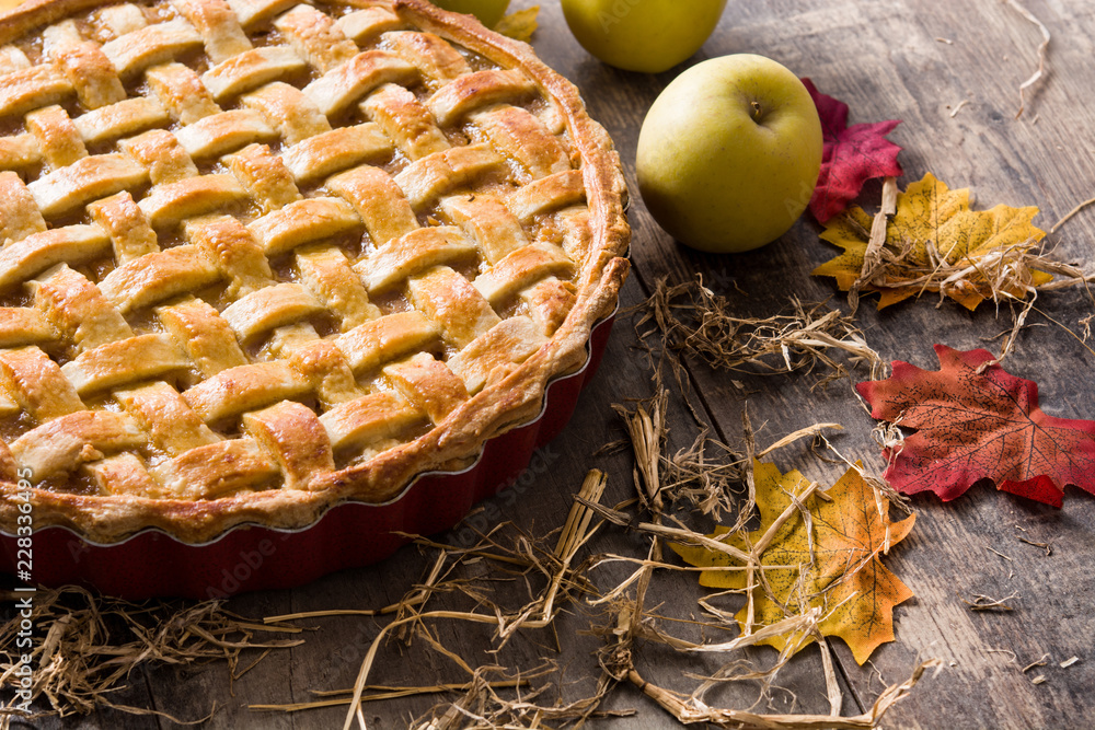 Homemade traditional apple pie on wooden table Homemade traditional apple pie on wooden table