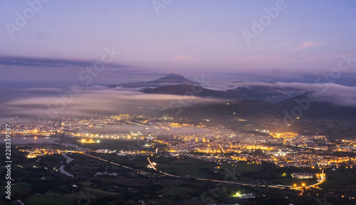 Misty night view of Irun city in Basque Country