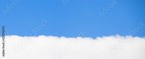 Single cloud with blue sky
