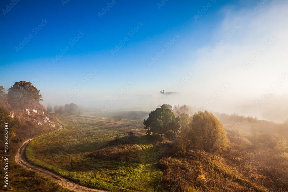 Abbey Tyniec surrounded by meandering Vistula river in colorful autumn scenery. Worth seeing nature reserve of Krakow