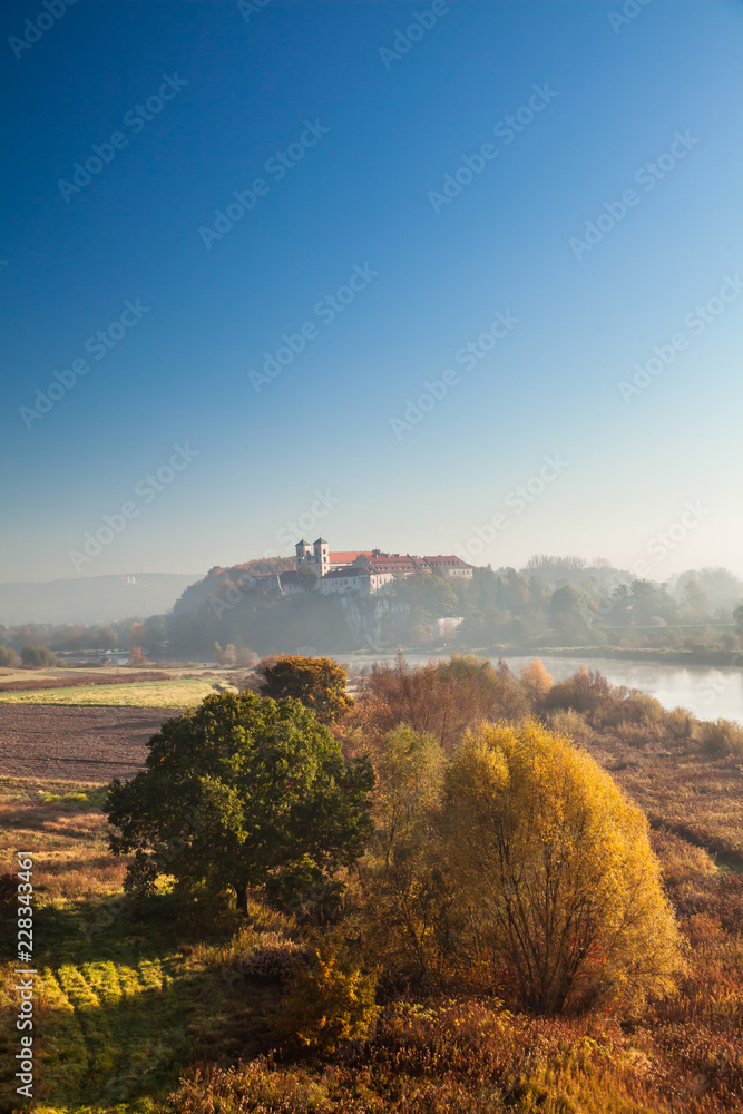 Abbey Tyniec surrounded by meandering Vistula river in colorful autumn scenery. Worth seeing nature reserve of Krakow