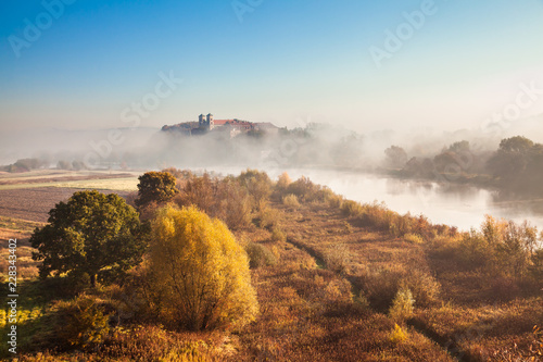 Abbey Tyniec surrounded by meandering Vistula river in colorful autumn scenery. Worth seeing nature reserve of Krakow