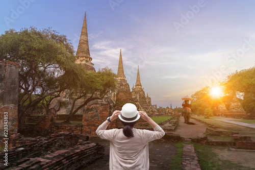 Foreign tourists Elephant ride to visit Ayutthaya, There are ruins and templesi in the Ayutthaya period.Concept is Travel in temple phar sri sanphet.