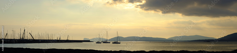 Alghero, Italy - Panoramic sunset view of the Gulf of Alghero and marina