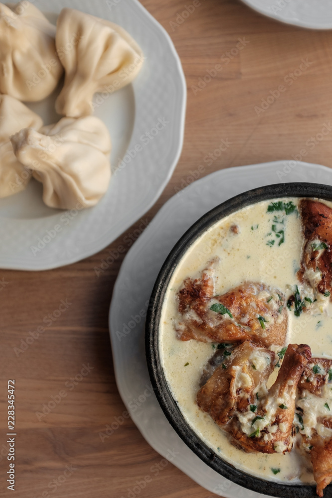 Chicken in a creamy sauce with garlic and herbs, khinkali. 