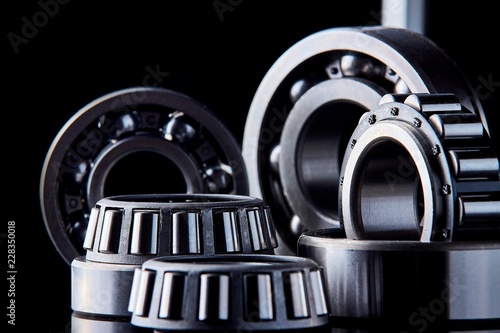 Canvas Print Close-up of a set of ball and roller bearings on a dark background