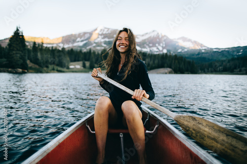 Smiling woman in canoe photo